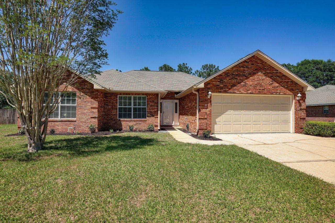 *New Roof* This wonderful 3 bedroom, 2 bath home features a double garage, nice open floorplan with eat in kitchen and separate dining room. The kitchen has tons of cabinets and counter space, stainless steel appliances, and a walk in pantry. Laminate wood flooring throughout the living and dining room. High ceilings and brick fireplace finish out the large living room. Master bedroom is huge with a large walk-in closet, updated bath with new tile, wainscoting and double sink vanity. All ceiling fans and light fixtures in the home are new which really add a modern touch throughout the home. Enormous (FLAT) back yard ready for your new pool or room to roam.