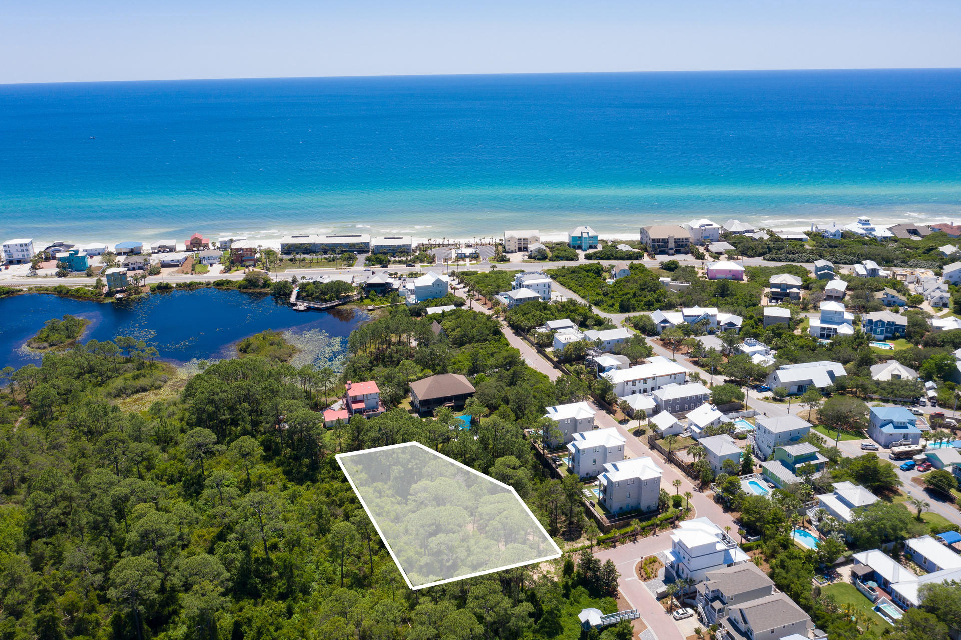 This much larger than average lot has character not available from a small lot in a neighborhood. It is large enough to have a unique wooded rolling elevation that would be as much a part of your future build as the wonderful location. Only about 350 yards from a beach access and 30A makes it a quick walk or bike ride to get to the beach, restaurants, pedestrian path, and more. The lot is outside of any restrictive HOAs. There is no buildout time so you can buy now and build without getting extra layers of permission for builder or plan approvals, or you could buy now and build later. Whether you are looking to build the perfect primary, second or investment property this is an ideally situated lot on the west end of Scenic Highway 30A. Adjacent lot is available also.