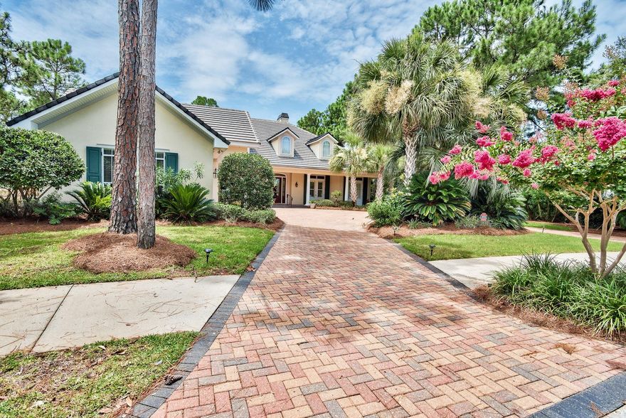 Resort Living at its best awaits in this charming Southern Coastal home in Sandestin. Nestled against the 16th fairway of the signature Raven Golf Course, this stylish home sits on a corner location providing both privacy and the feel of a much larger homesite. The curved paved drive and the elegant long front porch welcomes one to a home designed for the Sandestin lifestyle, The open floor plan flows beautifully, providing space for upscale living and entertaining. Couples who cook together will appreciate the well-appointed kitchen which features two work areas and miles of granite counter space and cabinets. Best of all nearly all of the are on home is on the first floor with a split plan that gives owners a private master retreat. The master is spacious and light with a sitting area