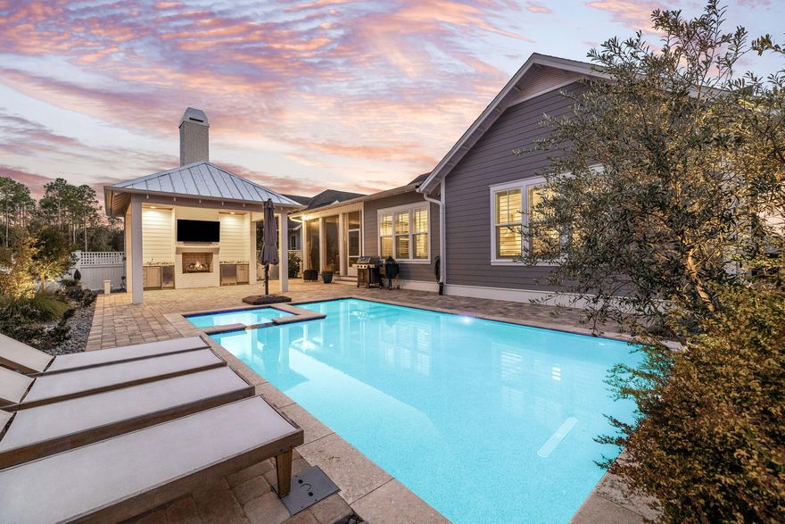 Tucked away on a quiet five-home street in the coveted Stillwater phase of Watersound Origins, this 2020 Huff Home offers a rare combination of privacy, function, and resort-style living. Positioned on a spacious lot with a wooded preserve behind and a community park in front, this highly upgraded Gardenia plan provides 2,770 square feet of thoughtfully designed space with four oversized bedrooms, a dedicated office, and three and a half bathrooms.Inside, 10-foot ceilings, eight-foot doors, crown molding, and shiplap accents create a refined coastal feel. The gourmet kitchen features floor-to-ceiling cabinetry, granite countertops, and Bosch appliances including a vent hood and drawer microwave. Each bedroom is generously sized to fit a king bed, while custom closets and spa-inspired baths elevate everyday living. The primary suite offers a peaceful retreat with an expansive en-suite bath.

The backyard is a private oasis with a heated Gunite/Pebble Tec pool and spa framed by an expansive paver patio, lush landscaping, and a privacy fence. A newly built cabana includes a gas fireplace, ice maker, full bathroom, and additional storage. Outdoor lighting, a screened porch, and an iPhone-controlled pool system make the space ideal for both entertaining and relaxation. Additional upgrades include a whole-house generator, Culligan water filtration, and a security system.

Watersound Origins residents enjoy a state-of-the-art fitness center, seasonally heated community pool, executive golf course, tennis and pickleball, scenic trails, and Lake Powell access with kayaks and canoes. Optional membership in the St. Joe Beach Club provides private beach access, multiple pools, Gulf-front dining, and championship golf.

Located minutes from the new Publix Town Center and the restaurants and boutiques of 30A, this property offers a one-of-a-kind opportunity to enjoy the best of coastal living in a prime location.