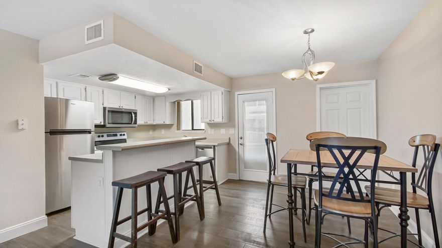 Gated Community- 2Bed/ 2 1/2Bath Townhome located across the street from the beach with a Private Clubhouse, snack bar and pool on the beach. Freshly painted, new flooring, new stainless steel appliances, new roof 2019. Low HOA fees, you can't beat the Amenities- 11 Pools- 5heated & 1 on the beach, 4 tennis courts, fitness center, 18 hole mini golf, 2 playgrounds, shuffleboard courts, conference center and golf cart community. Looking for a second home, vacation rental, this is it. Age, SF & Dimensions are approximate.