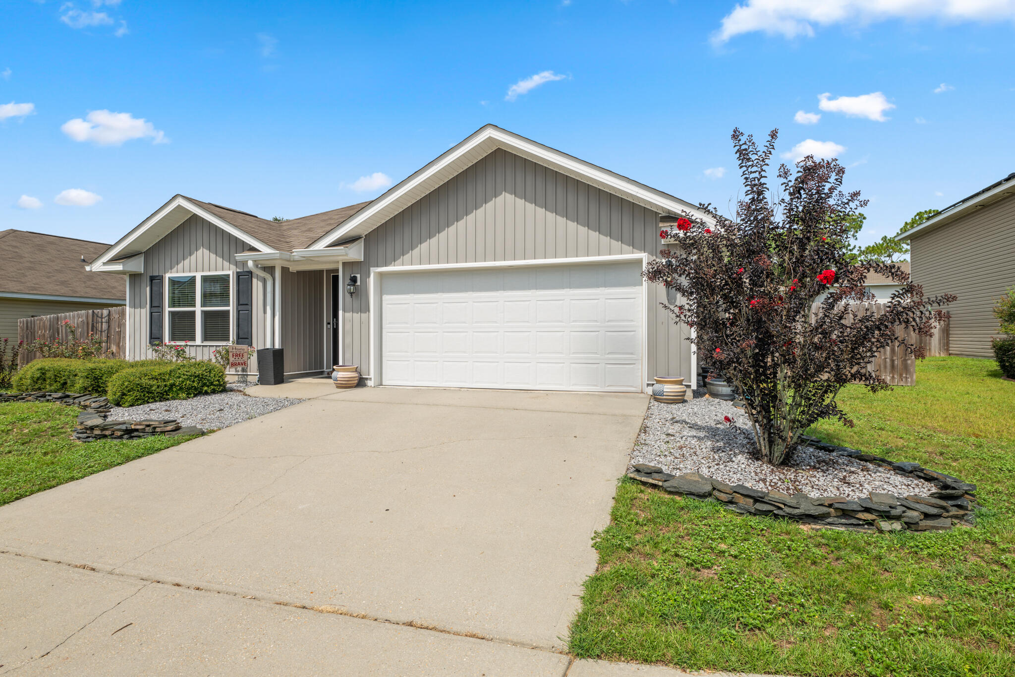 Welcome to this fantastic 4 bedroom, 2 bathroom Milton home - centrally located and convenient to grocery stores, schools, local military bases, dining, downtown, shopping, and more! Built in 2018 -featuring a split floor plan and tons of seller updates. Excellent curb appeal with updated front landscaping. Open concept main living space with the kitchen, dining, and living areas seamlessly blending together to keep everyone in on the action while hosting or entertaining. New LG stainless steel appliances in the kitchen, upgraded light fixtures throughout the home, as well as upgraded built-in shelving in the walk-in pantry and laundry room with custom barn door. The primary suite is just off the living room and features its own ensuite with upgraded vanity lights and mirrors, garden tub, separate shower, water closet, and the most amazing walk-in closet! Just off the dining room is a door to the screened in patio space in the backyard. The extended concrete pad sets up the perfect backyard entertaining space - ready for you to set up your grill! Plus, the coolest gravel and paver lined garden/terrace area in the side yard! Schedule your showing today!