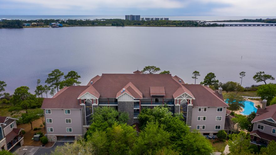 Gorgeous View of Lake Powell off Balcony! Fabulous Furnished 3 Bedroom/3 Bath New Flooring! Lakefront Condominium with Amazing Views of Lake Powell! Located at the border of Northwest Florida's Walton, and Bay Counties at Lake Powell, this Wild Heron condominium is located on a rare coastal dune lake, and is pristine! This first floor condominium overlooks the lake and the view is breathtaking! This condominium was designed using the most premium upgrades available including Australian Pine Flooring, Stainless Steel SubZero Appliances, Granite countertops, and much more. Wild Heron is a 750-acre coastal sanctuary with top notch amenities including the Greg Norman designed Sharks Tooth Golf Club, pools, fitness center, kayaks, tennis courts, boardwalks and gated entrance!
