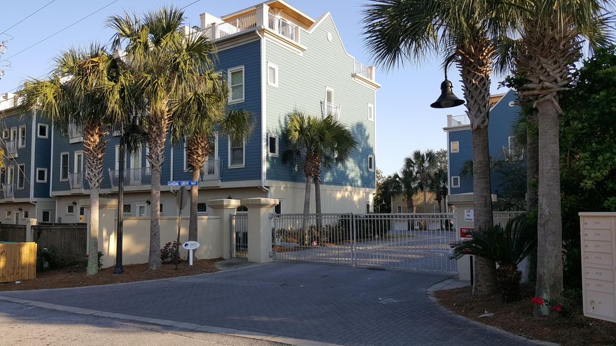 Beautiful Townhome in gated community just minutes from the beaches. Very low density 13 unit high end complex with community pool. The unit features an open floor plan with crown molding, raised ceilings on the second floor with the Great Room, Dining and large Kitchen. Kitchen is equipped with cherry cabinets, granite counter tops with loads of counter space, large breakfast bar and stainless steel appliances. Master Bedroom & Bath along with Guest Bedroom & Bath on the 3rd floor. Unit features beautiful hardwood flooring throughout. Ground floor offers tile flooring throughout with a bedroom & full Bath. All Bathrooms also have tile flooring. Unit being sold furnished except for personal items. Third floor has a spiral staircase that leads to the balcony on top of the unit