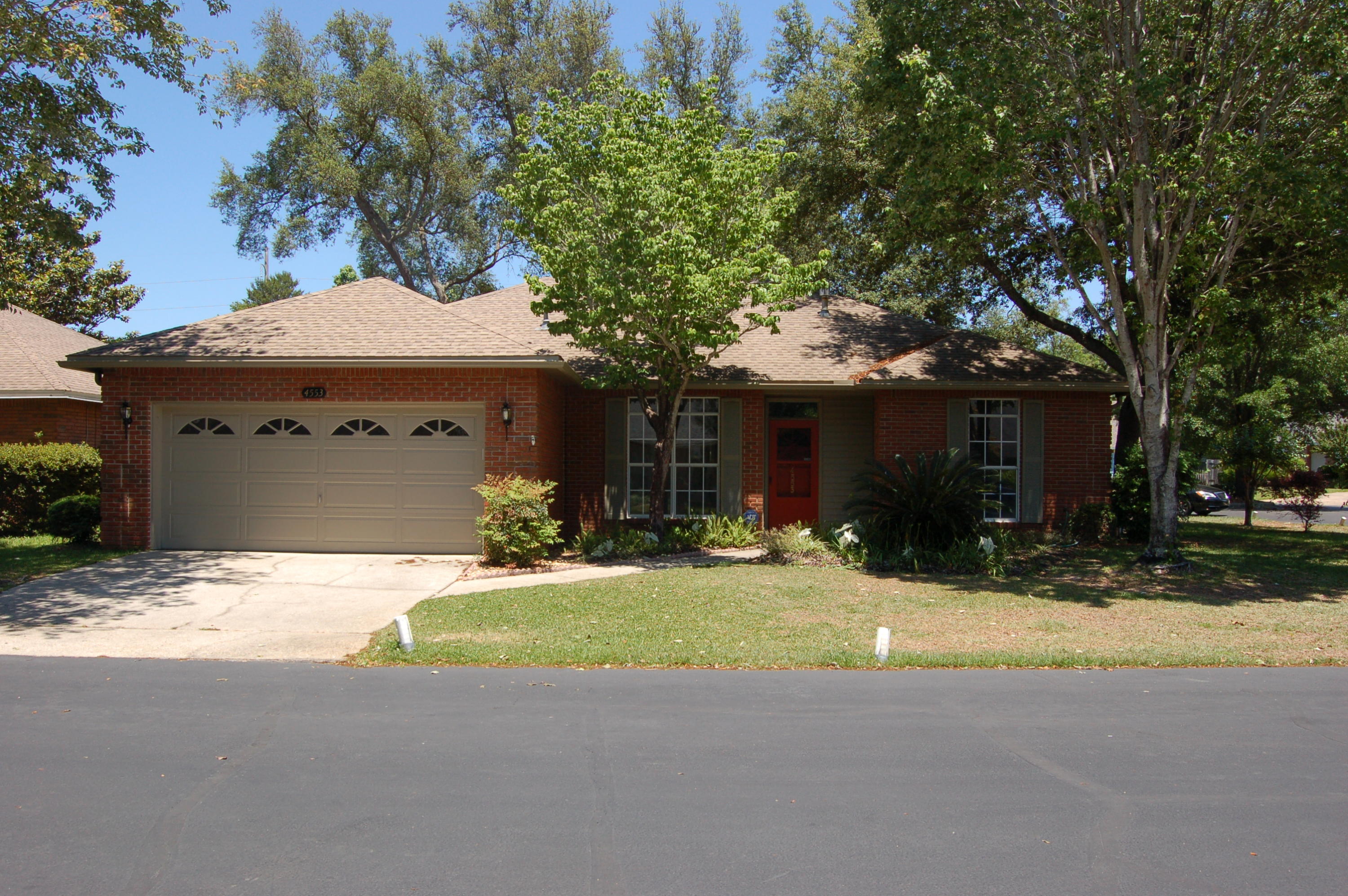 Brick charmer home on a corner lot in cul-de-sac, just a stone's throw from Bluewater Elementary School. Completely renovated, no more popcorn ceiling! Midnight blue kitchen cabinets with white underneath are perfect for distressing. New flooring, paint, kitchen, bathrooms and fixtures. Kitchen has new Silestone quartz countertops and new appliances along with Island that is movable but not on wheels. Extra room with French doors can be office or formal dining room. Roof is under 10 years old w/30 year warranty. New HVAC, and ducts. Screens and glass windows are a great feature for this enclose tiled Florida room included in sq.ft. Large fenced back yard and large side yard big enough for a pool.This home is very user friendly, with large kitchen and family rooms. Split floor plan