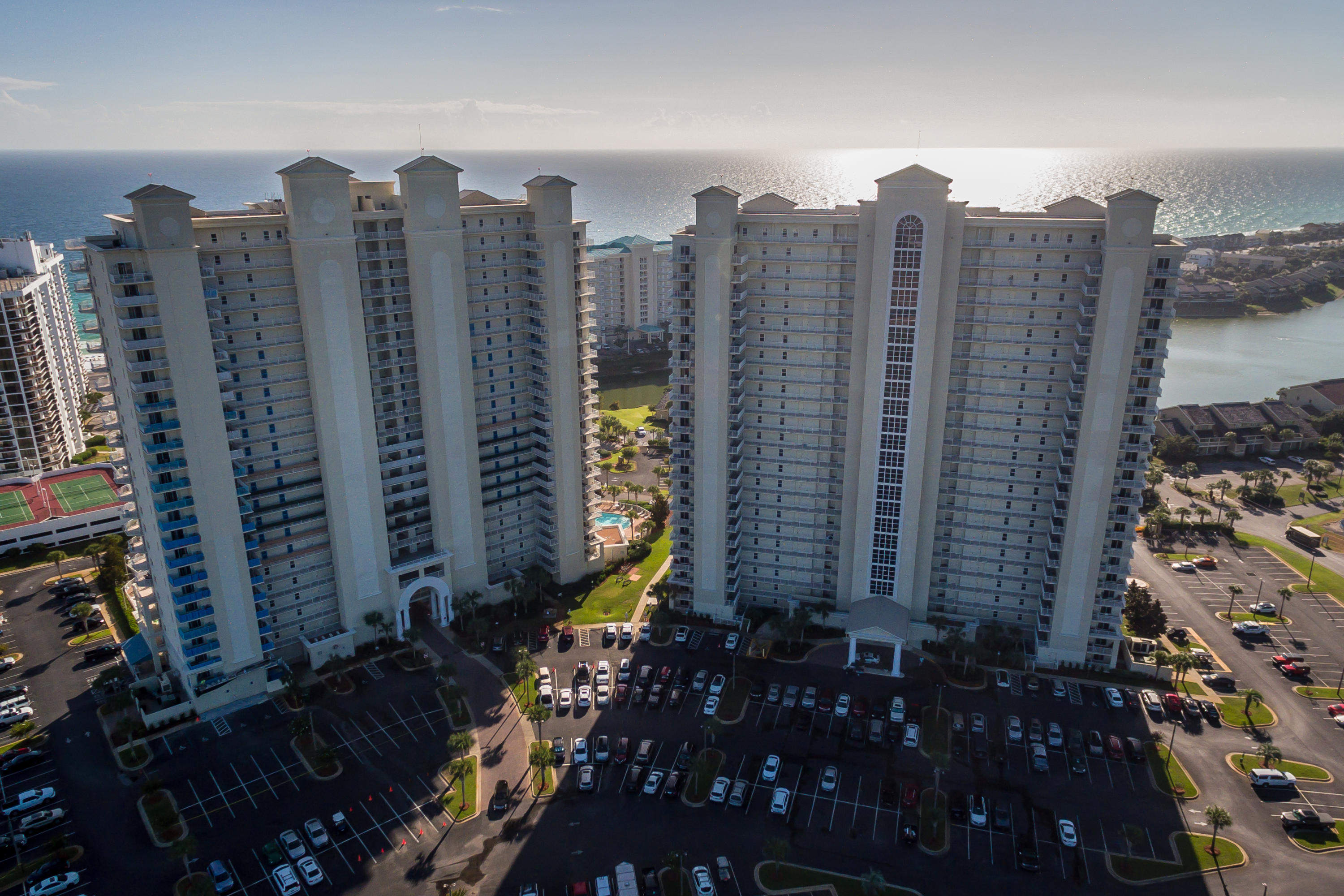 Welcome to Ariel Dunes at Seascape! This amazing 23rd floor condominium is surrounded with tremendous views - white sandy beaches and emerald waters of the Gulf of Mexico from the kitchen, family room & balcony and beautiful golf course & Bay views from the master bedroom. This one- bedroom unit offers a spacious living area with a warm and inviting atmosphere. This unit comfortably sleeps six making it an excellent rental investment. The unit offers a spacious bedroom with king size bed, fully equipped kitchen, granite counter tops, stainless steel appliances, and breakfast bar, a relaxing family / dining room combination, 1 1/2 baths, hallway bunks for extra sleeping, easy maintenance tile floors throughout and exterior Owner's closet. Do not let this fantastic opportunity pass you by.