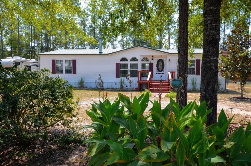 Looking for move in ready, convenient to bases, shopping and some space for solitude? You found it! Affordable, and ready to show, this Home has recently installed metal roof and HVAC system, two large storage buildings (one that is used as a workshop). Most of the 1/2 acre is fenced and the entire parcel is cleared and flat. Home has a well, but there is available public water if you'd like to go that way. Lots of TLC can be seen throughout this property included newly tiled kitchen, baths, and laundry room. New fixtures and tiled surround in full bath, as well as newly installed fixtures and working jacuzzi tub in Master Bath. Kitchen has newer matching stainless steel appliances, including matching fridge, tiled tops and more. A must see to appreciate. Call today!!