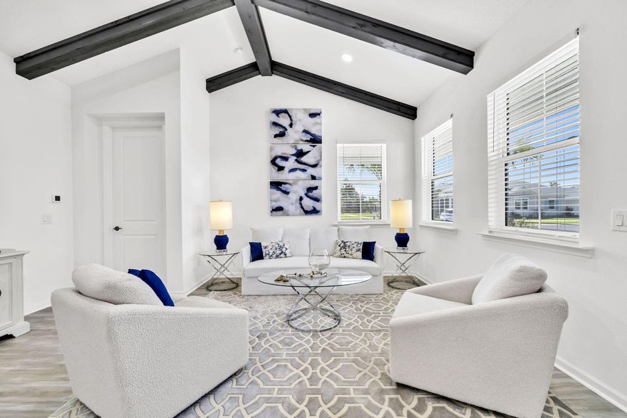 Move right into this street-facing Dreamsicle cottage in Latitude Margaritaville Watersound--where 55+ living feels like a vacation every day. This home showcases thoughtful upgrades, including a waterproof high-performance laminate wood floor throughout for a seamless look, a soaring beamed ceiling, designer lighting, and a custom slipcover sofa. The kitchen boasts quartz countertops upgraded to a rare level five with a matching quartz backsplash--an elegant and valuable enhancement. Both showers feature higher-level tile, and a 75-inch TV conveys for added convenience. The spacious wraparound porch has a cool-seal finish for year-round comfort, and the home's placement provides added breathing room with extra space to the side. Located in Section 6BC, a highly active part of the community, residents enjoy Friday happy hours, cookouts, and gatherings at the Flip Flop area. Latitude Margaritaville Watersound also offers world-class amenitiesresort-style pools, fitness centers, restaurants, live entertainment, pickleball, tennis, and an exciting calendar of social events. This cottage blends stylish upgrades, a desirable location, and a vibrant lifestyle, making it a standout in one of Florida's most sought-after 55+ destinations.