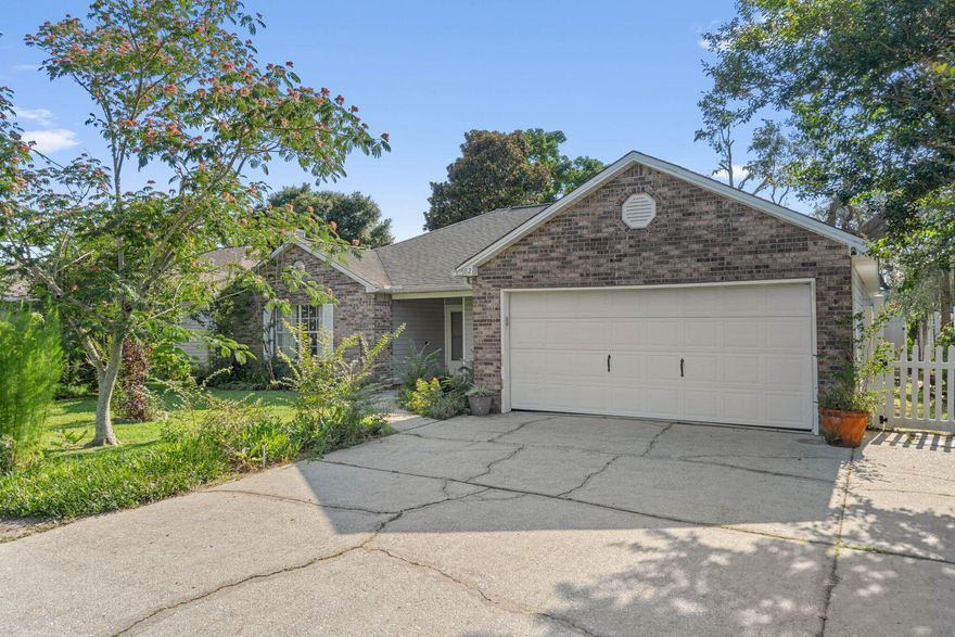 Welcome to this move-in ready 4-bedroom, 2-bathroom home that perfectly blends comfort and convenience. Featuring a cozy screened-in back porch, this residence invites you to relax and enjoy the outdoors in any weather. The kitchen offers ample countertop space and a high breakfast bar perfect for bar stools. Equipped with white appliances and a wine rack above the refrigerator, the kitchen also boasts a breakfast nook for casual dining and a formal dining room for more formal gatherings. The master bedroom and living room both feature tray ceilings, adding a touch of elegance to your living spaces. The clean and fully functional fireplace in the living room provides warmth and a cozy ambiance during cooler months. Practical features include a new HVAC system ( March 2024), a brand new Water Heater (June 2024), a washer and dryer conveniently located inside, gutters to protect the home's exterior and a 2 car garage. The full interior has been freshly painted in Agreeable Grey, with newly painted ceilings and all-new light fixtures, offering a bright and modern aesthetic throughout. Situated in a fantastic location, this home is incredibly convenient to Eglin and Hurlburt Air Force Base. It's also just a short drive to beautiful beaches and an array of restaurants. The fenced-in yard provides privacy and a safe space for children or pets to play. Don't miss out on this wonderful opportunity to own a beautiful home in a prime location! 