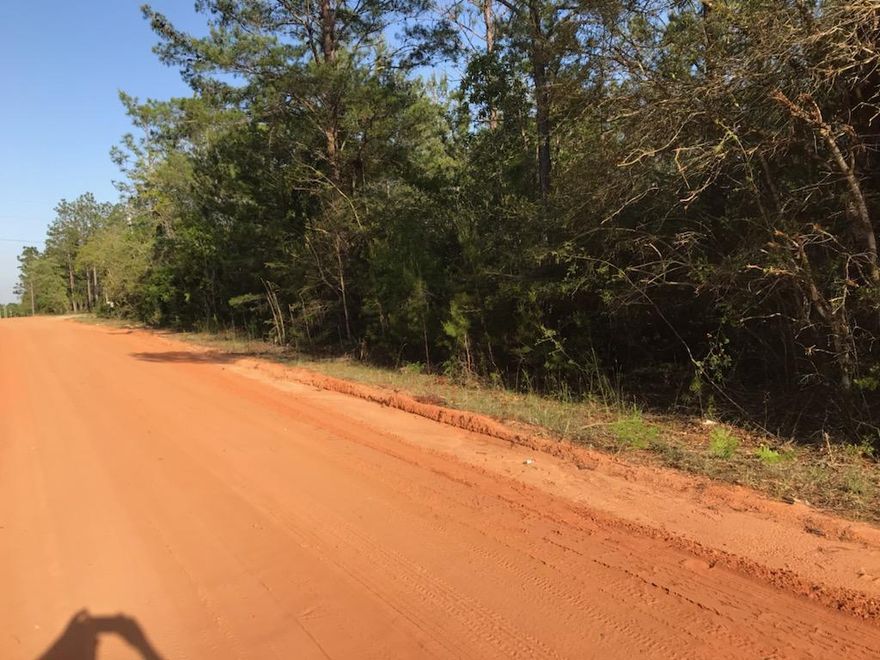 Welcome to the country! 2 +/- acres just minutes from Crestview and NO HOA. Property is on a county maintained dirt/clay road with several new homes on High Ridge Rd. Bring your  house plans and enjoy the tranquility of the country.