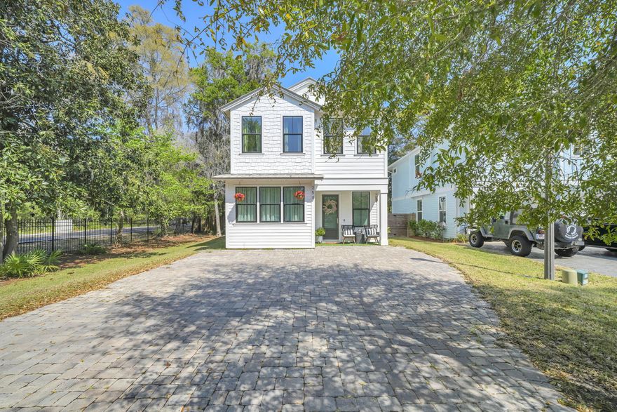 Walk to the bay and enjoy coastal living in this beautifully upgraded Florida cottage in sought-after Sacred Oaks. The community offers a shared boat dock, brick-paved streets, underground utilities, and a scenic walkover to the open bay.This 3-bedroom, 2.5-bath home features 1,866 sq ft of thoughtfully designed space with an open-concept layout and elevated finishes throughout. The updated kitchen shines with ceiling-height cabinetry, an expanded island, quartz countertops, subway tile backsplash, and custom details. The primary bath has been transformed into a spa-like retreat.Additional highlights include a metal roof, spray foam insulation, and a private backyard with a stained wood deck--perfect for relaxing or entertaining.