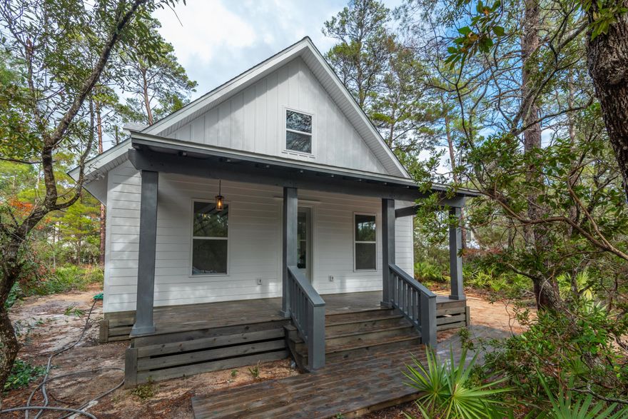 Interested in a  quality built quiet and cozy retreat in a prime Point Washington location? This 2,046 sqft., three-bedroom, three bath new construction home is located on a high and dry lot adjacent to the Grayton Bayou neighborhood. Located just one-quarter mile from a public access ramp to Choctawhatchee Bay for boating, kayaking, paddleboarding and more. Outdoor enthusiasts and families can launch their own personal watercraft within steps from the front door.  Wonderful starter home, vacation retreat or rental investment. The open floor plan is ideal for entertaining as well as remote work as it offers two separate primary suites including a flex room that could serve as an office or other living space. The kitchen boasts stainless steel appliances, quartz countertops, lots of natural light and large pantry.  Enjoy the quiet bayou views from a spacious covered front porch or lounge on the expanded back porch overlooking a back yard ready for fun or private al fresco dining. An extended driveway space allows for multiple cars, space for boat and trailer or recreational vehicle.
*Not currently shown in the photos are the glass shower doors, closet shelving and gravel driveway.