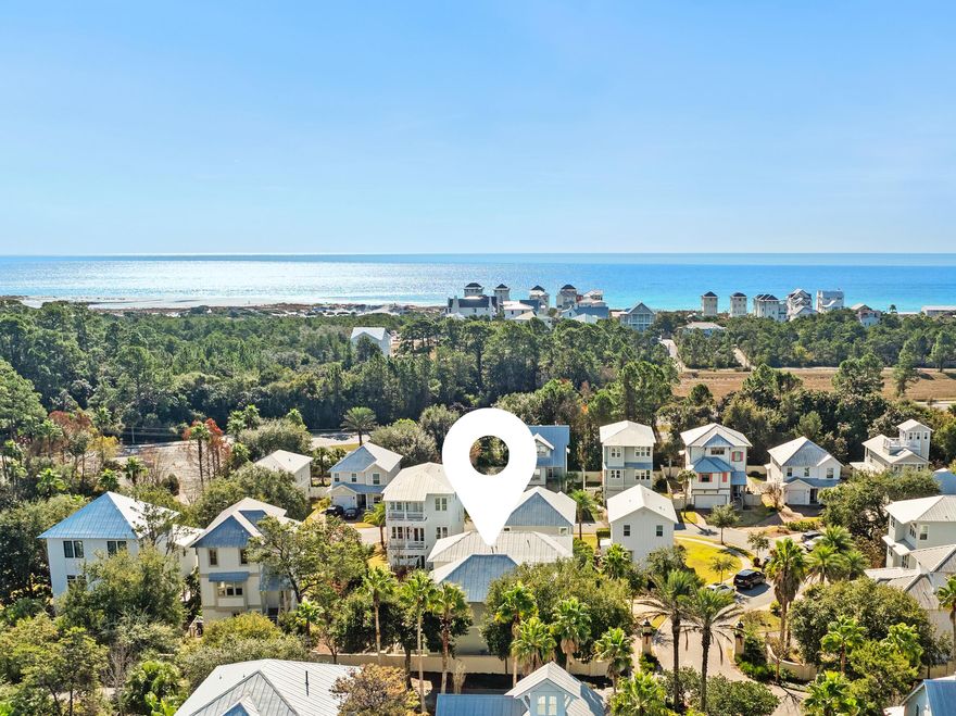 Located in the Grande Pointe neighborhood of Inlet Beach, this 4-bedroom, 3.5-bath home with a one-car garage for convenience and beach gear, offers a spacious and well-designed layout with two primary suites, two living areas, and a dedicated dining room. The floor plan provides flexibility across both levels, with separation between living spaces that works well for everyday use, hosting or as a short term rental.The main living area features an open kitchen with pantry anchored by a large island with granite countertops, stainless steel appliances, white cabinetry, and a tile backsplash. The kitchen opens seamlessly to the living and dining areas, creating a bright and connected space filled with natural light. A second living area upstairs offers additional room for relaxation, media, or flexible use.Two primary bedrooms (one downstairs and one upstairs) provide comfortable accommodations, while the remaining bedrooms include walk-in closets, are well-proportioned and thoughtfully placed. Interior finishes include wood flooring, new tankless hot water heater in 2024, 9' ceilings upstairs and downstairs, neutral tones, and clean architectural details throughout. 

Outdoor living includes a covered back porch and yard area, extending the usable space beyond the interior. The Grande Pointe community offers resort-style amenities including a resort-style pool, green space and access with dock to Coastal Dune Lake Powell.

The location is convenient to a large public beach access, 30Avenue, and a variety of nearby restaurants and shopping options. The home's layout, proximity to public beach access, and community amenities make it a strong option for a primary residence, second home or investment property.