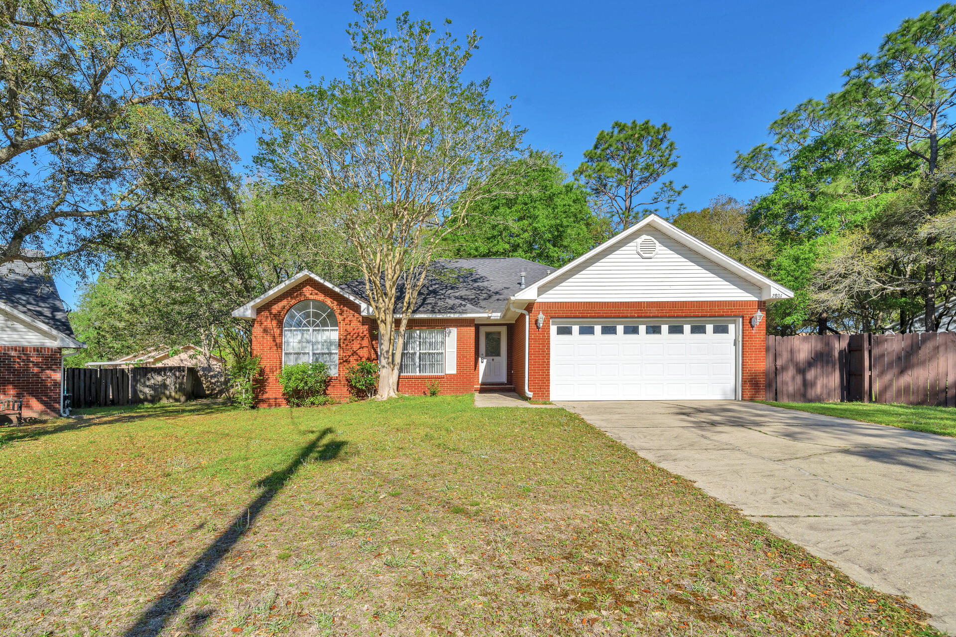 Beautiful brick home south of I-10.  Situated on a cul-de-sac, this home features a very large, updated kitchen with pantry and granite countertops.  The living room boasts of gas fireplace, cathedral ceiling and french doors leading onto a screened lanai that overlooks fenced back yard.  Master bedroom has trey ceiling, separate shower and walk in closet.  A must see!