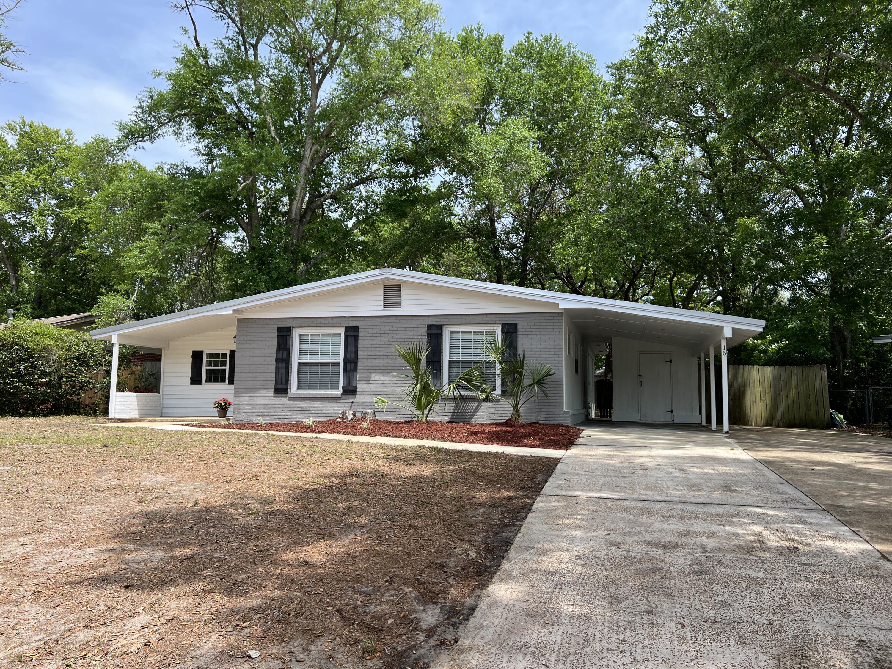Don't let the age of this home fool you! The effective age per the property appraiser is 2009! The home has been rewired, new windows, kitchen and bath renovations along with a new metal roof in 2016. Bright white kitchen with granite counters and stainless steel appliances. Kitchen could be expanded by adding an island or a peninsula under the windows. The large nearly 1/4 acre homesite is anointed with beautiful mature trees. There is a covered carport with a storage room along with an extra parking pad for boat or extra cars. You are a just a short distance to the Mary Esther city pier and boat ramp on the Sound. This rare 4 bedroom 2 full bath home offers large bedrooms and a bonus room. Great location within minutes to Eglin AFB or Hurlburt Field!