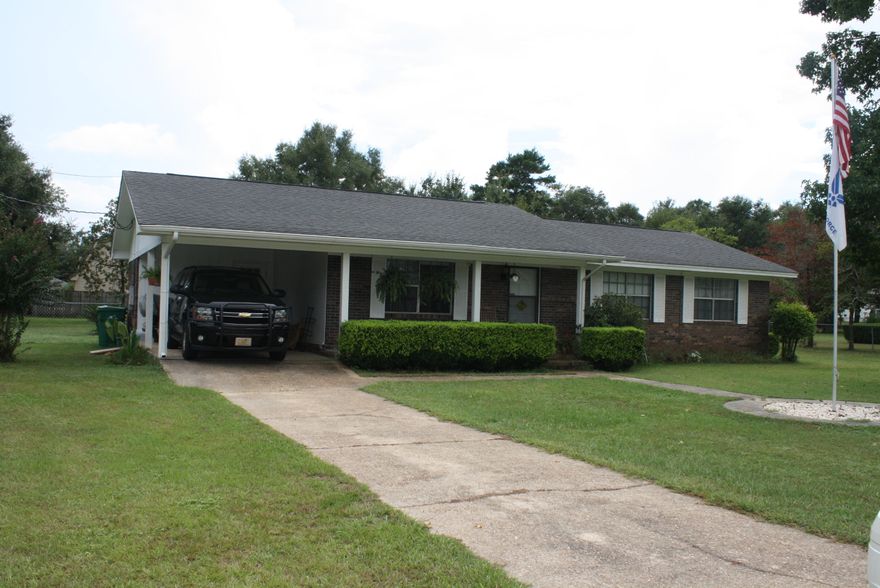 Looking for a quiet location to enjoy the outdoors? This is the perfect home! Situated on over half an acre of property, the back yard is a dream! The backyard is fully fenced and the front yard is spacious as well. The home is a 3 bedroom, 2 FULL bath that lives large. Living room is carpeted and has ceiling fan. The kitchen opens into a dining room and features a breakfast bar, smooth top stove/oven, fridge, and dishwasher. The hall bathroom has double sinks. All bedrooms feature carpet and ceiling fans. Indoor laundry room has entry to backyard and is very large with additional storage. Carport for all your covered outdoor storage of vehicles. Come view this property today!