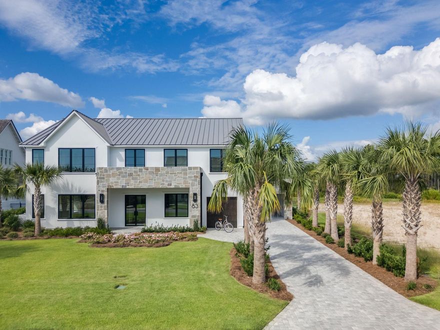 Experience refined coastal living at its finest in this extraordinary 2024-built residence, located in the highly coveted and gated Watersound Camp Creek community--home to the exclusive Beach Club and Camp Creek Golf Course. Spanning 5,334 square feet, this architectural gem offers 5 bedrooms, 6.5 baths, and a seamless integration of indoor and outdoor living, ideal for those seeking a full-time sanctuary by the sea. From the moment you step inside, you'll be captivated by soaring 10-foot ceilings, warm European oak flooring, and an open layout that invites effortless flow and entertaining. A spacious fireside great room anchors the main level, opening into a gourmet kitchen outfitted with a striking marble waterfall island, bespoke lighting, European-style cabinetry, and high-end Dacor graphite stainless appliances. A walk-in pantry and prep space enhance its culinary appeal, while a separate dining room, complete with wet bar, wine fridge, and ice maker, makes entertaining a breeze.
The main floor also features one of two stunning primary suites with a spa-inspired bathroom, a soaking tub, and a walk-in closet the size of a bedroomperfect for custom design. You'll also find a dedicated office/library, full pool bath, powder room, generous laundry/mudroom, and additional storage. Upstairs, luxury continues with a second lavish primary suite, a bonus/media room that could convert to a sixth bedroom, built-in dual desk area, and a secondary flex roomideal as a fitness space or second office. Two additional en-suite bedrooms with large walk-in closets provide comfort and privacy for guests or family.
Set on nearly half an acre in a quiet cul-de-sac, the backyard is a private resort of its ownfeaturing a heated saltwater pool with sun shelf, infinity-edge hot tub, outdoor fireplace, summer kitchen, and a 500 sq. ft. covered loggia. The fenced yard offers abundant green space for play or pets. Parking is effortless with a two-car garage (epoxy floors & EV charger), a separate golf cart garage, and a two-car porte-coch??re.
Completing this exceptional offering is a detached carriage house with its own private entry, vaulted ceilings, kitchenette, walk-in closet, and full bathideal for guests, in-laws, or a creative studio. This is more than a homeit's a lifestyle. Welcome to 83 Norman Court, where craftsmanship, privacy, and elegance converge in one of the most exclusive enclaves along 30A. Schedule your private tour today.
