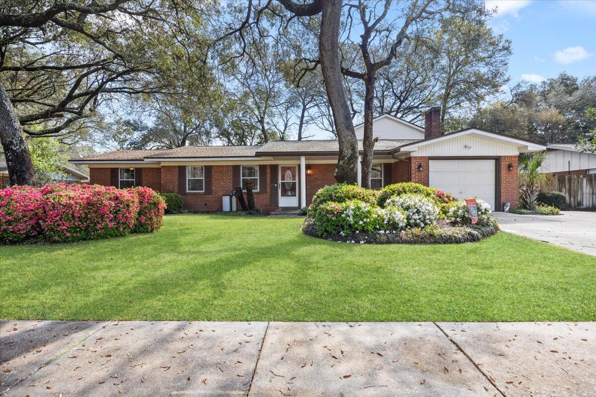Live at the center of it all in this vibrant Fort Walton Beach sanctuary. With a split floor plan, TWO spacious living rooms, a BONUS room, AND a tucked-away upstairs bedroom that's perfect for a kids' hideaway, or an in-home theater space. This home was made for both relaxing and entertaining. The kitchen dazzles with granite countertops, tile flooring, and stainless steel appliances. Step outside to your own backyard oasis surrounded by a pristine garden, plus plenty of space to add a dream pool or outdoor kitchen. Roof replaced last summer. Schools are within walking distance, as well as a community park! Enjoy quick access to beaches and shopping. There is aluminum wiring, but seller is willing to remedy upon an accepted offer.