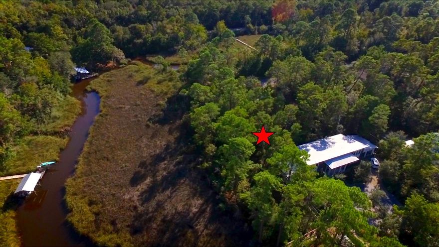 Waterfront lot on deep water McQuage Bayou. Build here and take your kayak or boat to Choctawhatchee Bay! Secluded, tranquil setting to call home by the bay. Visualize opportunities with construction drawings available for a 2 story home with garage and guest suite. Recorded Easement through lot 6 & 7 provides access to this parcel. Great location for nature lovers along the bayou. Put in a dock and enjoy life out on the water. Savor a quite lifestyle near the bay where the action of the beach at Grayton is just a 10 minute drive away. ***Buyer is responsible for personally verifying details about this property. All information contained on the listing is believed to be accurate, yet not guaranteed. ***