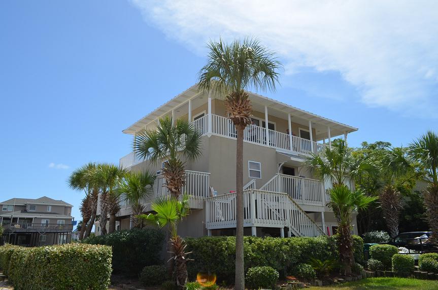 Lowest Priced Canal Front Home on Holiday Isle. This terrific waterfront home welcomes you through the leaded glass entry to 3,100 Sq. Ft. of recently renovated a boater's dream home. 80 Ft of waterfront and 2 boat slips with easy access to the gulf, 4BR/3.5BA, beautiful travertine in the kitchen and living areas, granite in the kitchen and baths, a corner fireplace in the master are only some of the features of this retreat. A first floor mini-kitchen helps get your boat ready for fishing or sunset cruising. Elevator makes for easy access to the upper floors. Fully furnished and ready to be your Destin-ation!