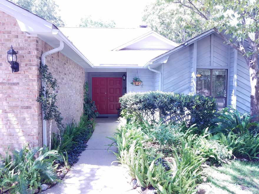 Welcome to the Woodlands, one of Bluewater Bay's most sought-after neighborhoods. Sited on a large tree-shaded lot with circular driveway, it feels as if you are entering a mini-estate. The back of the entire home is mostly glass so you will enjoy the views of your lush backyard. This beautiful contemporary has had the best of care and is now ready for a new family who will appreciate its open, sun-bright interior and open floor plan. The spacious great room features a cathedral ceiling, wood burning fireplace with fantastic brick surround, and a suite of lovely floor to ceiling windows. It's easy to imagine all the ways your family can enjoy this space. Easily entertain a couple or a crowd. The step-saver galley kitchen features ample workspace and cabinets with a built-in desk,