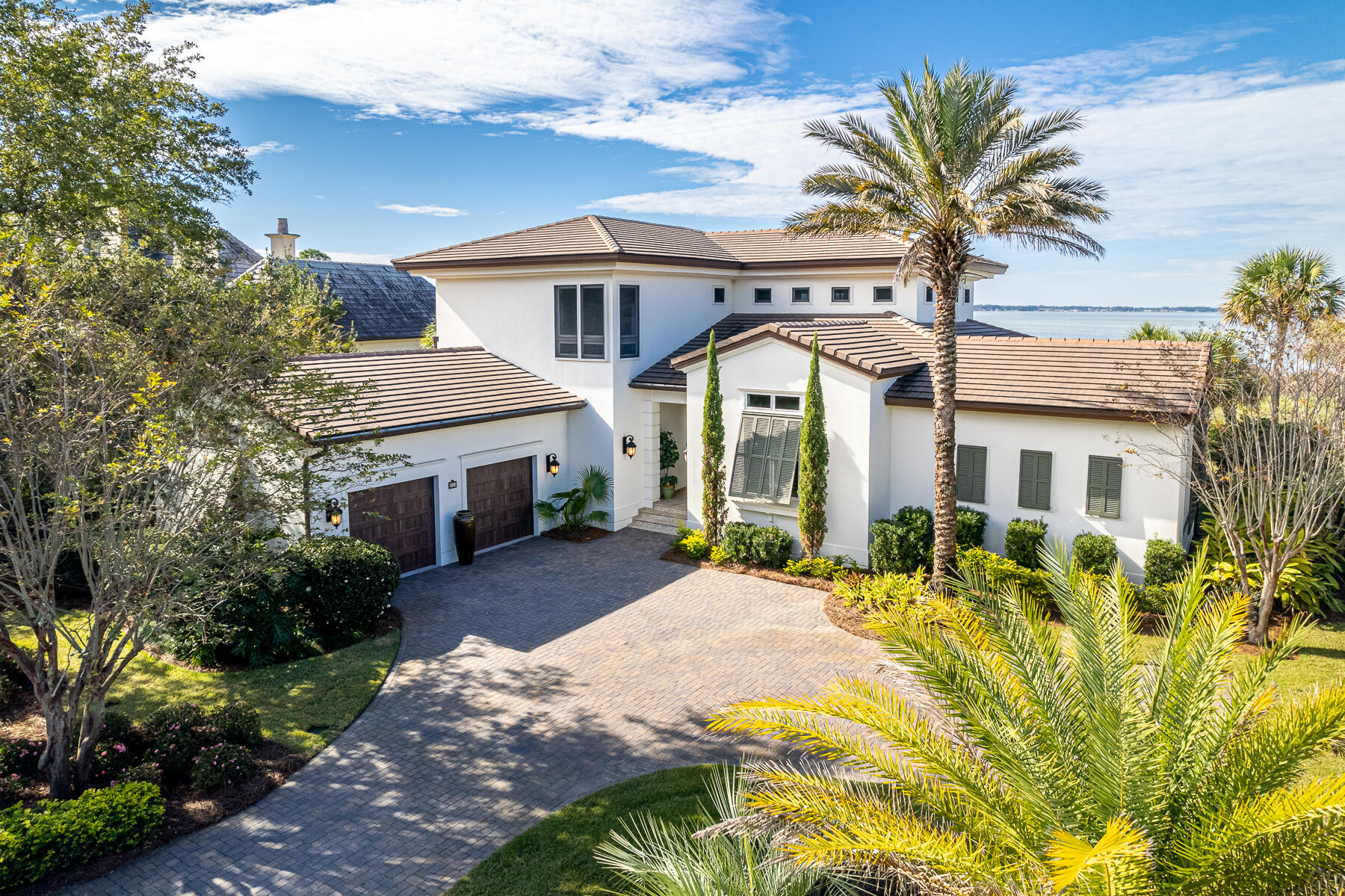 Incredible views over the 14th hole on Burnt Pine Golf Course and Choctawhatchee Bay can be enjoyed from this immaculately maintained home located on a private cul-de-sac within the exclusive, gated community of Burnt Pine. The seller is offering this estate fully furnished with a golf membership to Burnt Pine! The moment you walk through the mahogany French doors, you will be immersed into a great room with soaring cathedral ceilings and full-height windows that frame stunning views of the golf course and bay. Easy glide storm doors egress to the 680sqft screened lanai featuring a summer kitchen, gas fireplace and cozy lounging areas. The main floor features the primary suite, den/4th bedroom, and gourmet kitchen equipped with high-end stainless appliances, wine cooler, and ample storage.