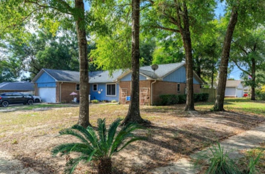 Looking for a great family home in the heart of Niceville? Then come check out this lovely split bedroom home on a corner lot on a street that ends in a cul-de-sac. The two things these owners loved about this home when they purchased it was the master suite and the quiet neighborhood. It's freshly painted and has new flooring throughout. The living room has a vaulted beamed ceiling and gas fireplace. The kitchen includes granite countertops, a mosaic tile backsplash and updated appliances including a convection oven. Washer and dryer do not convey.