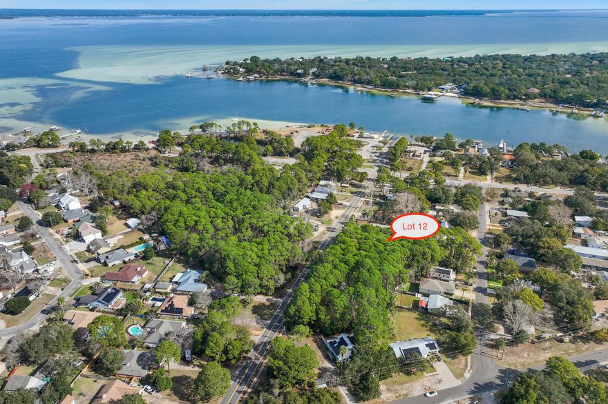 Vacant lot with no HOA located in the heart of Destin just steps to Joe's Bayou boat launch and minutes to the harbor, Destin Elementary School, and all of the shopping, restaurants, and beaches that this area is famous for. Seller financing is available. Buyer to please perform their own due diligence and verify all information in this listing. Wetlands are present on the lot, wetland mitigation has already been performed, buyer will need to apply for new State 404 wetland permit. Lots 13, 15, and 16 are also available as a bulk sale or can be purchased individually as well. Buyer to please verify all information contained herein.
