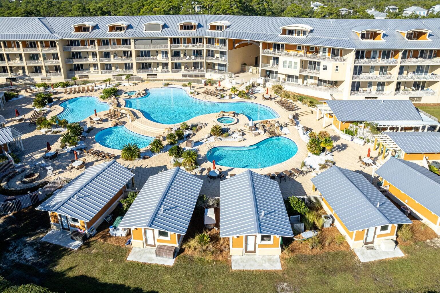 POOLSIDE CABANA AVAILABLE NOW EXCLUSIVE FOR OWNERS AT SANCTUARY AT REDFISH!! Beautifully upgraded cabana available for purchase only by current condominium owners at Sanctuary at Redfish. Escape the heat and relax in your air conditoned living room, complete with kitchenette and full bath with walk in shower! Upgrades include: New engineered wood flooring installed in 2022; freshly painted cabinets; plantation shutters; Newer HVAC with extended warranty that should be transferable; Ecobee Wi-Fi thermostat; New KitchenAid fridge; Samsung flatscreen TV; New ceiling fan. Selling fully furnished!