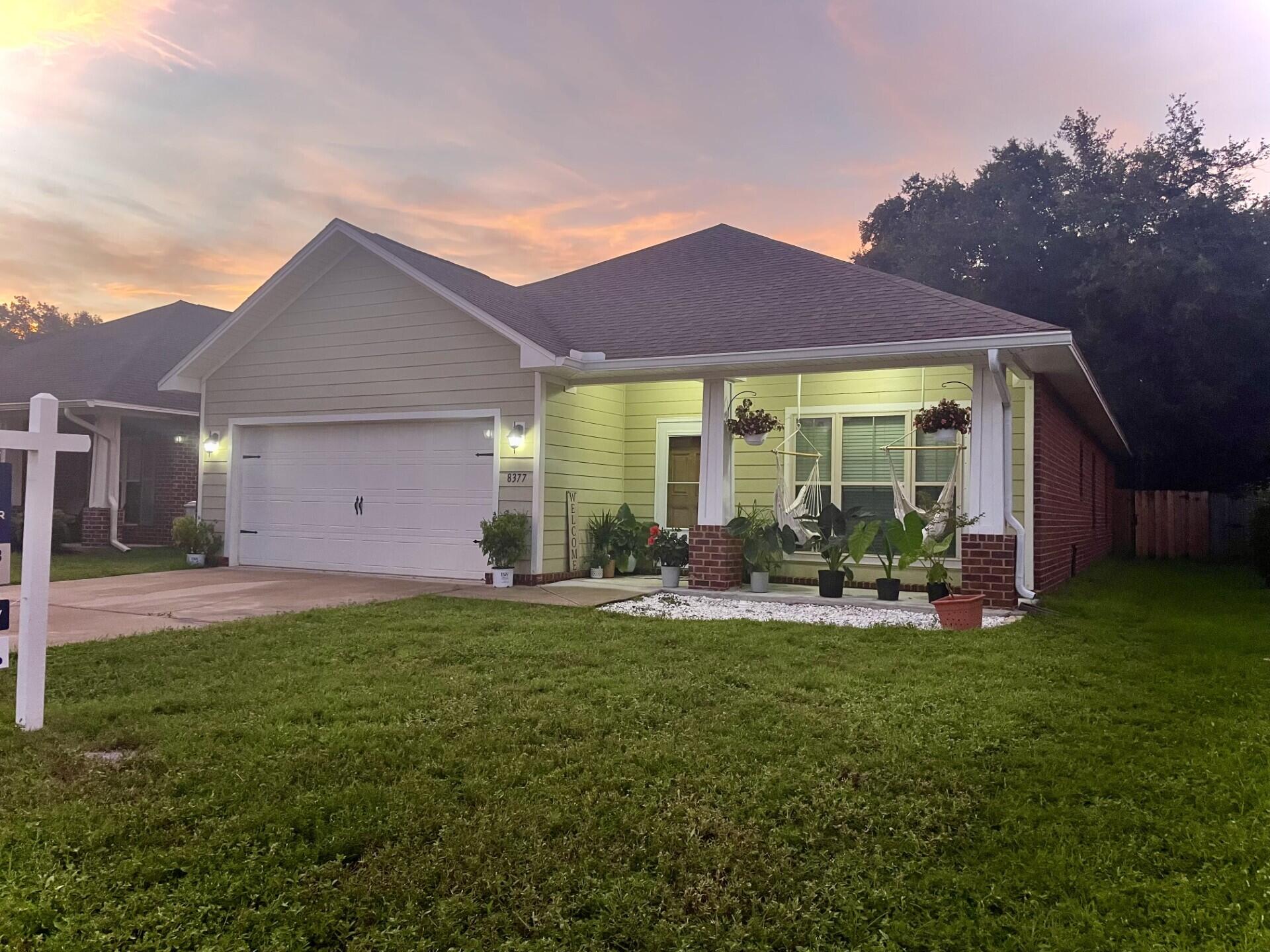 Ten minutes to Navarre Beach when you make this 4 bedroom Craftmans style home yours. You have an open floorplan with plenty of storage. Beautifully maintained and is like new. Just five minutes to Navarre High School and Publix. Updates include electric fireplace with shiplap, new fixtures, newly screened in back porch, custom shower, walk in closet, and fresh paint. Buyer will receive flooring allowance for the bedrooms at closing. New sod will be laid before closing, and bad fence boards to be replaced. The kitchen will have soft close drawers and the big trees have been removed. Laundry space and pantry area together. Stainless steel appliances plus washer/dryer stay. There is a sprinkler system and a shed in the back yard that are both As Is. Free home warranty, new LED lighting in t