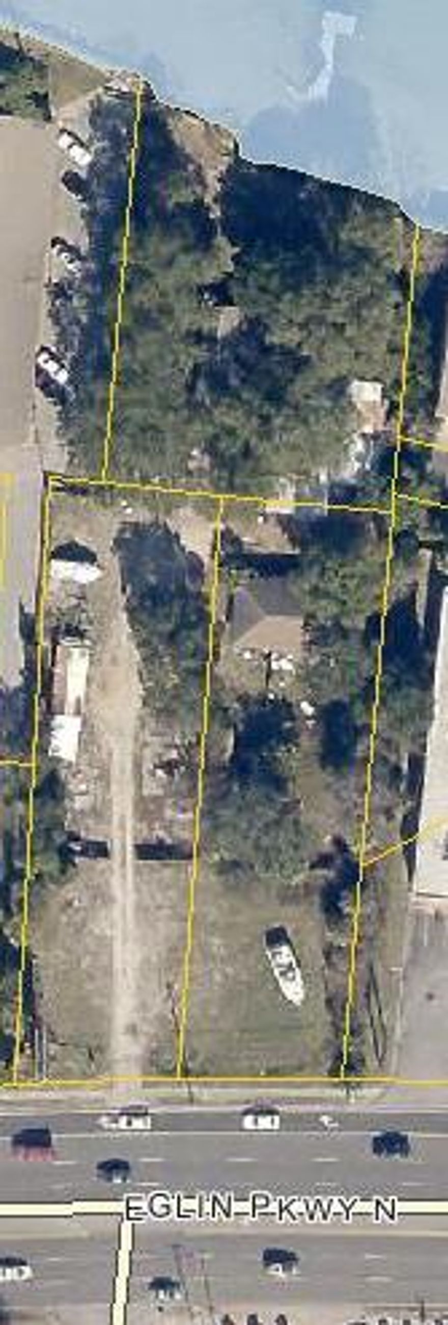 1.44 acre Commercial Tract, 155' on the water and 156' of road frontage, zoned commercial and multi family, currently has a duplex and 2 small homes and a single apartment on the property, great development site for commercial development or multi family