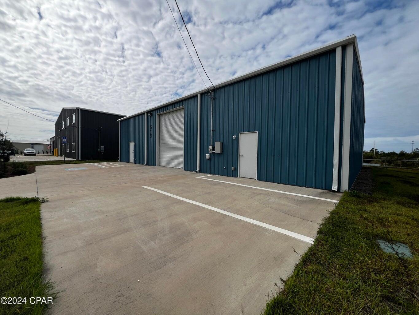 CALL FOR OFFERS! | OFFERS DUE BY NOON, FRIDAY, NOVEMBER 22, 2024.  Well maintained warehouse in Beach Commerce Park For Sale. The 4,060 square foot building was built in 2021. The owner has used the building for his car collection and work shop. Large mezzanine storage space, huge workshop, small office/breakroom/kitchen area, and one ADA restroom. 16' Eave-height. Grade-level rollup door 12'W x 14' H. Exhaust fan, two 'Big-Ass' fans, LED lighting, etc. This is a fantastic building for many different uses. Plans attached. Call for further details and to schedule a tour.