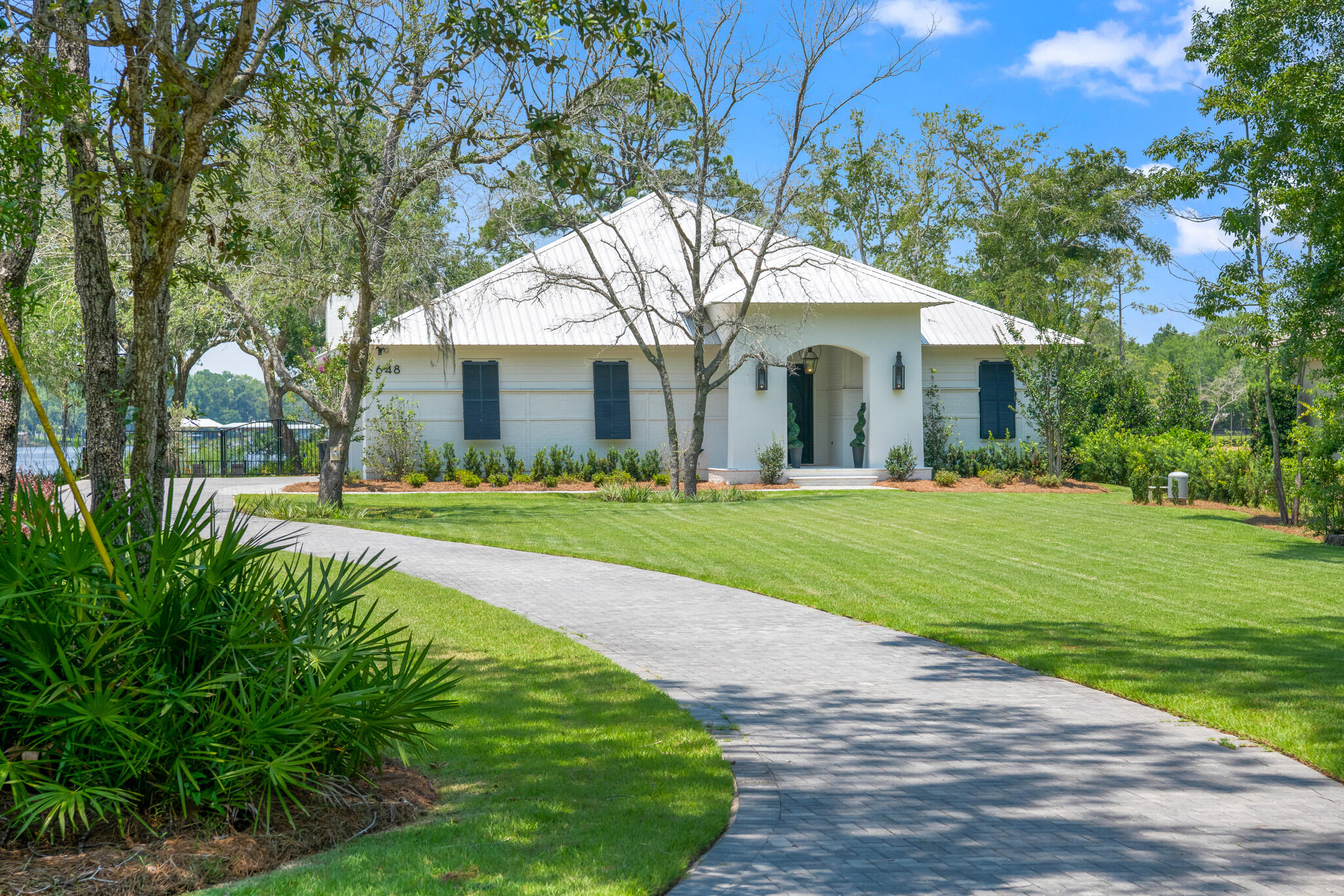 Introducing a jaw dropping 2020 waterfront property where meticulous design meets low-stress convenience and privacy. Nestled on an oversized lot, this magnificent home boasts 122 feet of deep-water Bayou frontage, offering an idyllic waterfront lifestyle with beautiful sunset views. As you step inside, you'll be immediately struck by the thoughtful layout, which maximizes both comfort and functionality. The interior spaces flow seamlessly, creating an atmosphere of effortless living. The living area and master bedroom have been strategically positioned to offer incredible sunset views, allowing you to enjoy the breathtaking beauty of nature from the comfort of your own home.