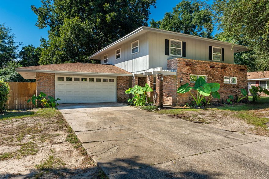 MOTIVATED SELLER - Will pay up to $10,000 in closing costs/repairs.  4 bedroom, 2 1/2 bath home in Raintree Estates. Best location close to Destin, Niceville and Eglin AFB. This home features living rm, family/dining rm with fireplace plus office/flex rm. Interior & exterior just painted, new flooring upstairs, new light fixtures, updated appliances, new quartz countertops in kitchen, new refrigerator & stovetop in '22, WH 2019, AC in 2021, double ovens 2019, dishwasher 2018. Koi pond at front entrance. Huge privacy fenced back yard with shade trees, patio, fire pit & herb garden. Waterfront community features a beach front park (see photos) plus a recreation park where the neighbors gather and play games. HOA fee of $200/year is voluntary, they ask you contribute if you use the amenitie