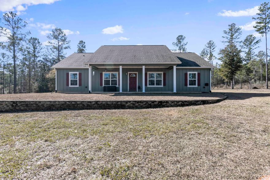 This charming single-family home is situated on 100 acre  peaceful rural setting. The home features 4 bedrooms, 2 baths and spacious living area. The exterior of the home is surrounded by lush green lawns and mature trees, providing plenty of shade and privacy. the property includes a large pole barn with a cabin attached, plenty of space for an RV or fifth wheel. This property is perfect for those who love the outdoors and a wonderland for kids to grow up in. Only 45 minutes to the greatest Beaches in Florida, and ten minutes to any of the most beautiful springs N.W Florida has to offer.