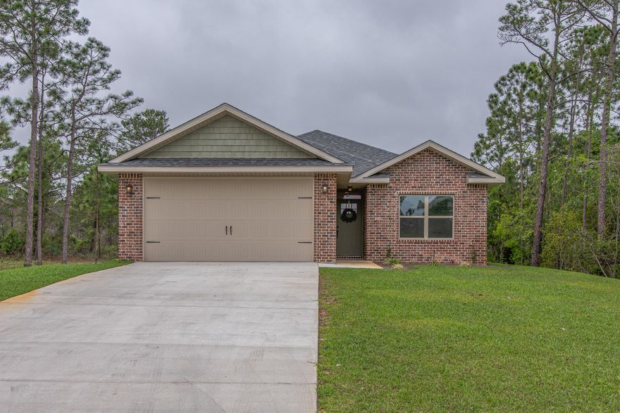 Brand new, semi-custom, and NO HOA? The builder didn't miss any detail when it came to this 3/2 in the Midway area of Gulf Breeze. From the wood grain vinyl to the granite counter tops, this house is gorgeous! Spend your evenings lounging in the large open living area, or relax in your master bathroom with custom standing shower, or in the oversize soaking tub. You'll also find a custom double bathroom vanity with a granite countertop, a water closet and his and hers walk-in closets! You will love the added details like having all of the windows trimmed out, soft close cabinets in the kitchen, 9' ceilings throughout, and a two car garage with an 8' door to fit larger SUVs and trucks!