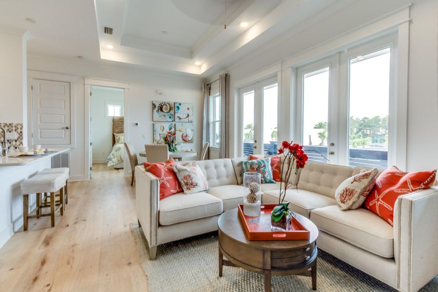 The Aruba Floor plan is uniquely designed with a one car garage attached. This incredible townhome features a vast open floor plan that opens to the large covered balcony. The Gourmet kitchen includes stainless steel appliances, granite counter tops, five burner gas cooktop. Crown molding and tray ceilings can be seen throughout the townhome. The master bathroom includes granite counter tops, dual vanity sinks in master bath, large walk-in closet, and a frameless glass shower. Residents will enjoy easy access to resort style pools, fitness area and private shuttle service to the beaches of 30A. Come join the excitement!