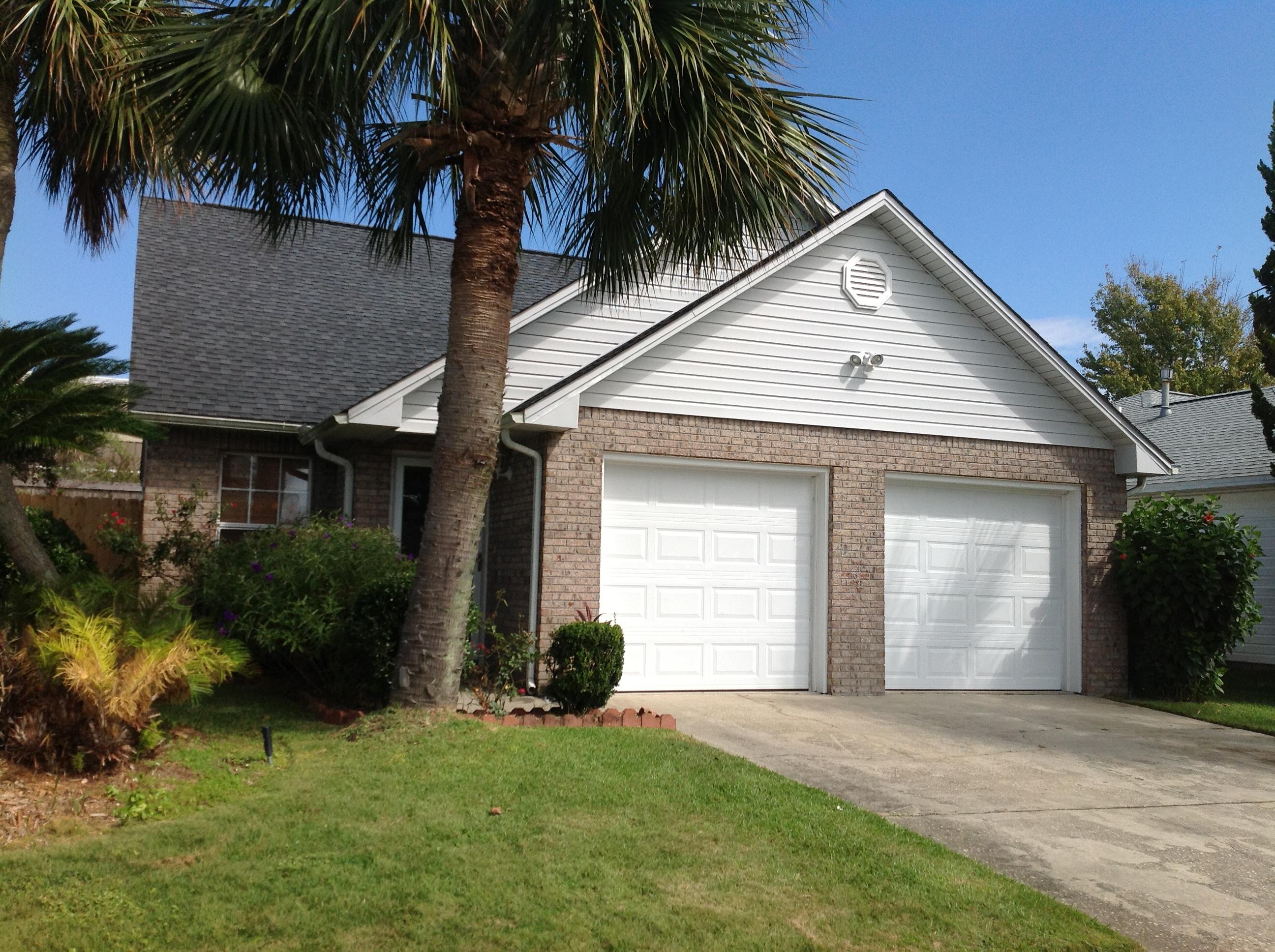 Nicely maintained heart of Destin property. This jewel is well appointed and lives large! The downstairs is light and bright boasting an open floor plan with beautiful tile floors throughout the main living spaces. This home's elegance flows through the kitchen featuring granite counters, beautiful wood cabinetry, and stainless steel appliances. Your owner's suite is also situated downstairs while your two guest bedrooms are upstairs with a bath in between. The well landscaped yard offers tropical foliage along with a large deck for entertaining and koi pond for relaxation. At this price, this home won't last!!! All dimensions to be verified by buyer.