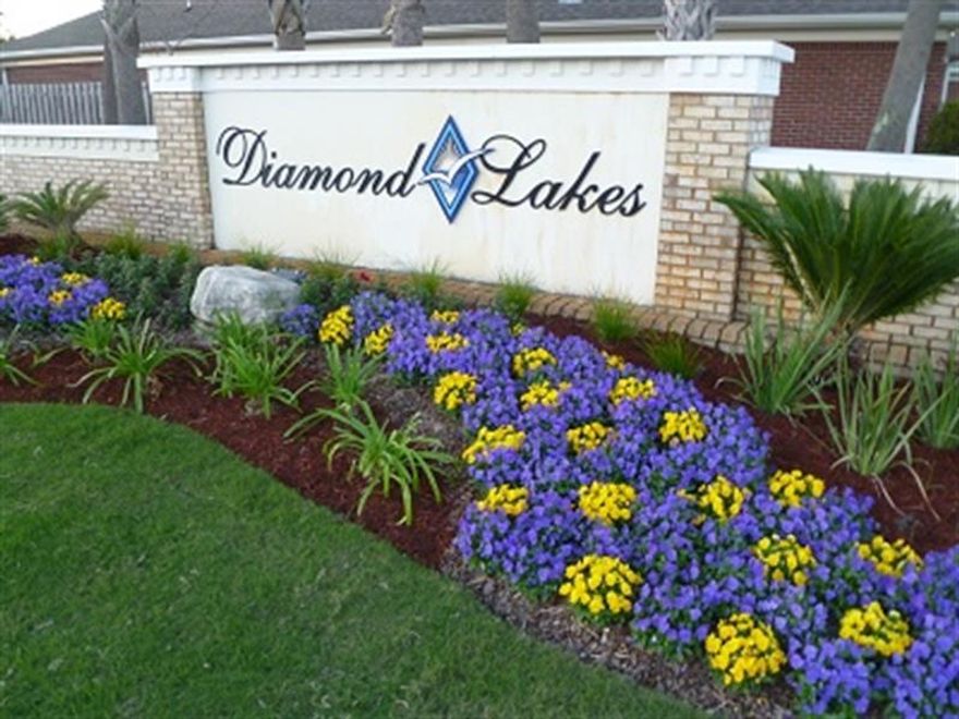 This spacious three bedroom, two bath, one level townhome is located in the sought after community of Diamond Lakes. This home has a two car garage, full sized laundry room, and an open floor plan with vaulted ceilings. Interior features a gas fireplace in the family room, Master bedroom has a huge closet and en-suite bath with a garden tub and walk in shower. The kitchen is equipped with stainless steel appliances and solid surface counters. Diamond Lakes is a quiet community with a large pool, landscaping service, and centrally located in Destin near beaches, shopping, schools and dining.