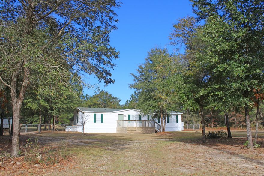 Spacious three-bedroom, two-bathroom home situated on a well-manicured one acre parcel in a very private but easily accessible location. There is so much more to this home than what meets the eye! Open floor plan, split bedrooms, over-sized kitchen that is attached to the dining area, master bedroom suite with his and her closets, plus so much more! On the outside, the back yard is fenced, there is a huge covered back porch and large open front porch that is perfect for entertaining! There is also a 40x24 pole barn and 32x12 storage building, both buildings have electricity and TV cable ran to them. So much thought has been put into this home and it is ready for you to make it yours! Call today for that opportunity!