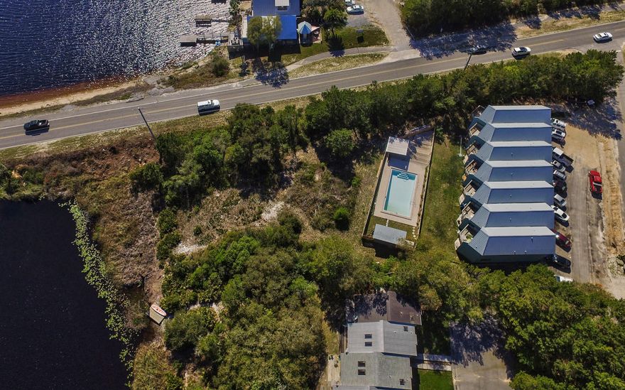 Attention Investors & Developers!! This is your chance to own an income producing, multi-unit property that has 137+ ft of 30A frontage and deeded lake access to Camp Creek Coastal Dune Lake. Seven total units are being sold together. The surrounding common area does not convey with the sale of the townhomes. Units are 2 bedrooms with 2.5 baths and have identical floor plans that consist of approximately 1,300 SqFt. Whether you renovate or redevelop, this property has endless rental potential! Call Erika Monk for details!