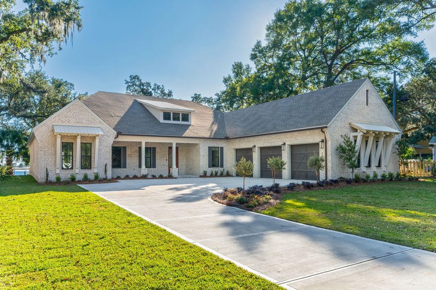 Set beneath a canopy of majestic and historic live oak trees and spanning approximately 91 feet of pristine deep waterfront, this 4,176-square-foot brand new custom 2026 built home offers a rare blend of natural beauty, thoughtful design, and refined coastal luxury along the Santa Rosa Sound and Intracoastal Waterway in Fort Walton Beach.Designed to honor its extraordinary setting, this elegant bayfront home captures sweeping water views from nearly every angle. Upon entry, expansive windows and carefully planned sightlines immediately draw your gaze to the Sound, where shimmering water and ever-changing skies become part of the home's daily rhythm. The open-concept living, dining, and kitchen spaces flow effortlessly together, creating an elegant yet inviting environment ideal for both relaxed living and effortless entertaining. Soaring 12 foot coffered tongue and groove ceilings enhance the sense of space while maintaining warmth with a touch of Southern charm. 

At the heart of the home, the chef's kitchen is a showpiece equipped with top-tier appliances including a six-burner Wolf range, Sub-Zero refrigeration, wine cooler, ice maker, and custom cabinetry. Whether hosting intimate gatherings or large celebrations, the kitchen and adjoining dining area highlighted by a distinctive brick accent wall offer a stunning backdrop of uninterrupted waterfront views.

The primary suite is a true private retreat, thoughtfully positioned in its own wing of the home. Vaulted ceilings, serene bayfront views, and direct access to the back patio create a peaceful escape. The spa-inspired ensuite features spacious dual vanities, a freestanding soaking tub beneath a stunning chandelier, a walk-in glass enclosed shower, private water closet, and an oversized custom closet designed for both form and function.

In total, the home offers four generously sized bedrooms plus a dedicated office, providing flexibility for guests, multigenerational living, or work-from-home needs. This home features a fantastic split floorpan with two primary suites, one in each wing.  Each space is designed with privacy, comfort, and timeless appeal in mind.

Outdoors, the waterfront lifestyle takes center stage. A welcoming outdoor fireplace sets the tone for evenings spent under the oaks, listening to the water and watching spectacular sunsets paint the sky. The expansive backyard offers ample room to add a pool and create a private outdoor oasis, along with space for a dock and boat lift, allowing effortless access to boating, paddle boarding, and life on the Sound. This property offers some of the deepest water in the an area for those who need deep water dockage due to its proximity alongside the channel.

This exceptional custom home is more than a residence--It's a legacy property, offering unparalleled views, historic natural surroundings, and the very best of coastal living. At the front(street side) of the lot, two additional coastal cottages are under construction offering you the possibility of purchasing all three properties if you need a mother in law home or additional investment properties. The additional two homes are not included in this sale and will be sold separately. 
