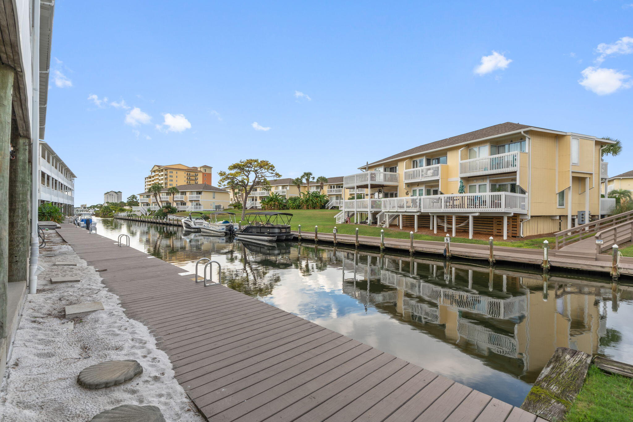 Very unique opportunity! Turnkey 2BR/2BA 1st-floor canal-front condo in Sandpiper Cove. Rare Unit!! Deeded parking directly on the canal with boat docking privileges--just steps from the platform to cruise straight to Destin Harbor. Enjoy tranquil canal views from 3 access points to a private balcony. Features include a spacious living area, full kitchen with bar, master suite with private bath, and Jack-and-Jill bath for guests. Nestled on 42 acres with deeded Gulf-front beach access, this gated community offers 5 pools (3 heated), par-3 9-hole golf, tennis, pickleball, marina/canal slip rentals, 24-hour security, and sugar-white sandy beaches.
