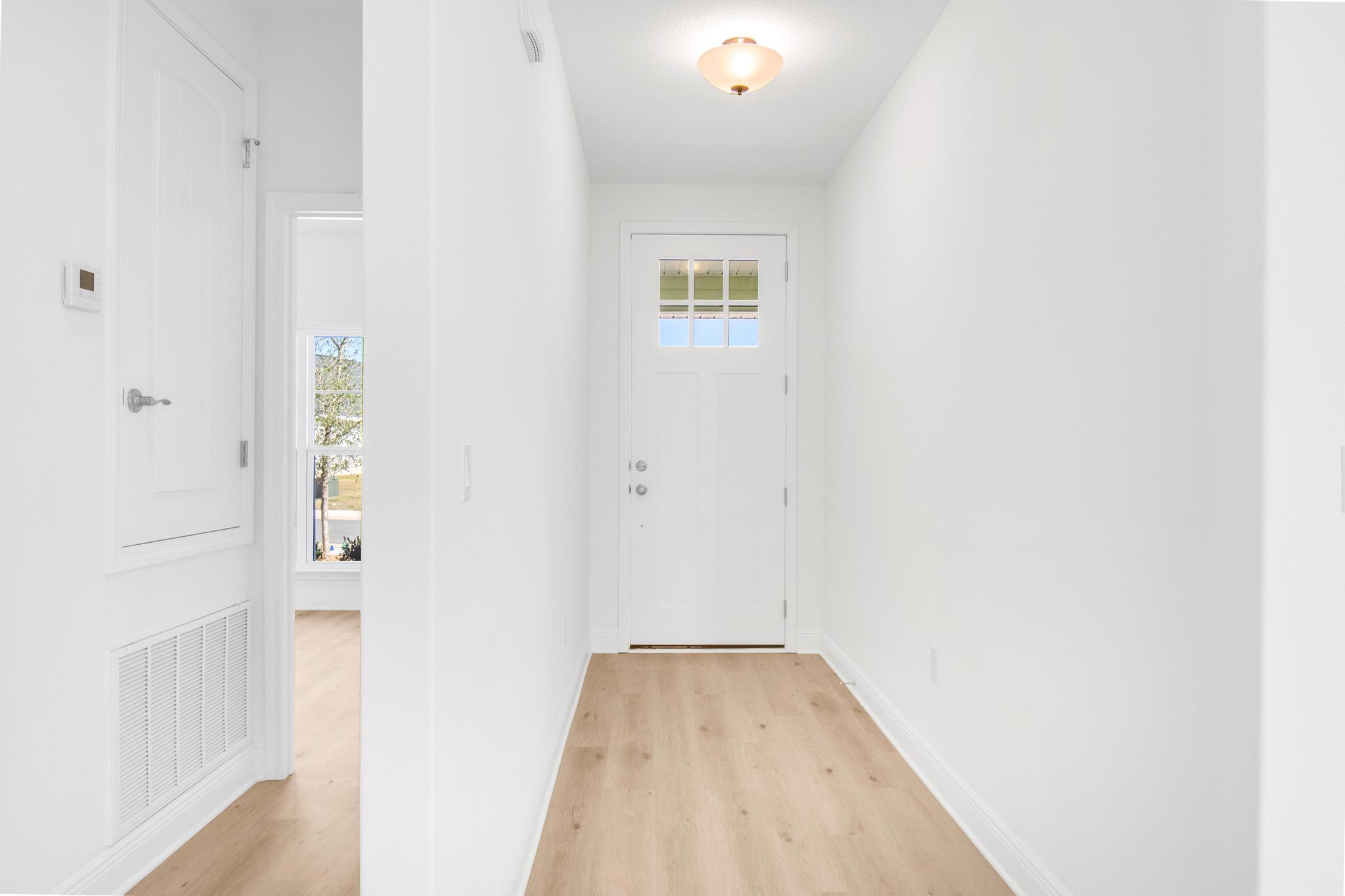 Limited time offer: 4.99% fixed rate financing (FHA/VA) + up to $10K flex money + builder pays most closing costs with a preferred lender. Open concept, large covered rear patio and large master bedroom help sell this plan. All ceilings at least 9', cathedral in main living area, tray ceiling in master bedroom, 8' entry doors. Located just 20 minutes to Blue Mountain Beach on the Gulf and 15 minutes to WalMart in DeFuniak Springs. Quartz countertops, durable CoreTec Pro Plus LVP flooring, fully sodded yard, sprinkler system with well and pump, garage door opener, pull-down attic stairs.