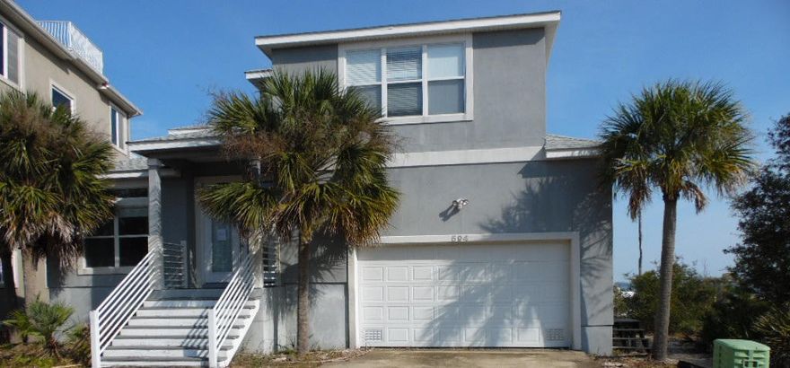 With some love this 3 bedroom, 2.5 bath would be the perfect residence or vacation home. Great views of the sound, with dock access, tile floors and an open floor plan with a gas fireplace. Awesome location, close to all the resorts have to offer! Property being sold ''AS IS''.