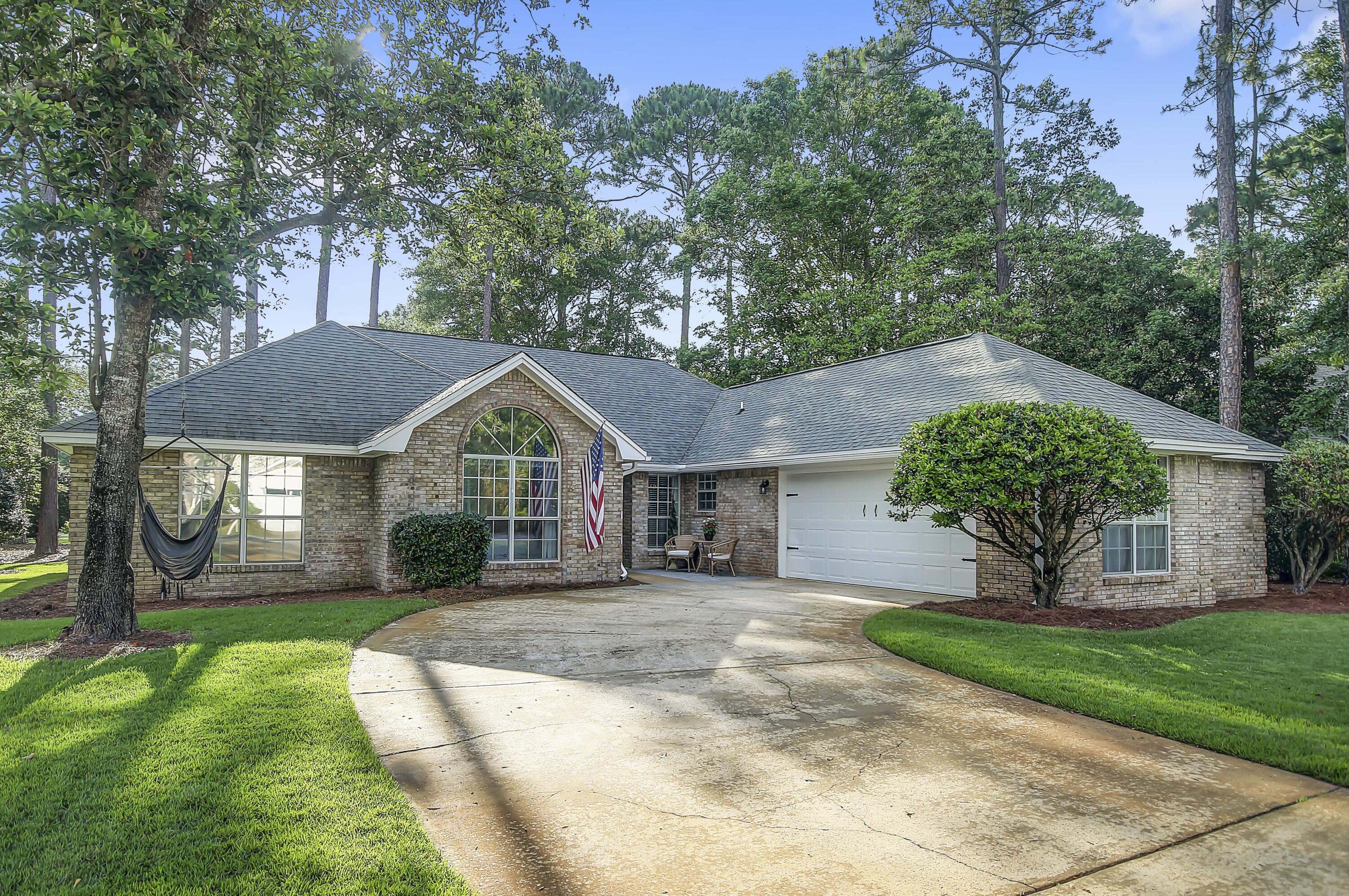 'Back on the market and ready for a lucky buyer - previous deal fell through due to buyer circumstances-Welcome to this 3BR/2BA all-brick home in Bluewater Bay. It boasts three living areas, including a versatile Florida Room addition, perfect for an office or playroom. The spacious kitchen has new granite counters and stainless steel sink. Enjoy the convenience of a side-entry garage and overhead storage. This home is a must-see, situated on a large corner lot in Southwind, fully fenced for privacy!