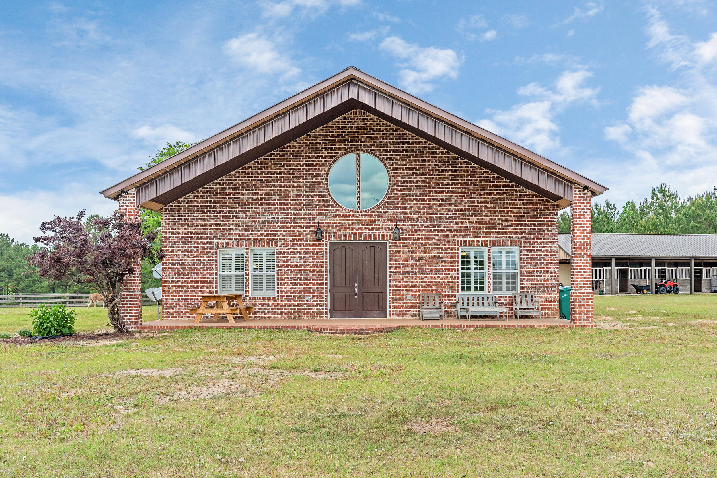 Charming 15-Acre Farmstead Near the Gulf CoastWelcome to your dream country escape south of I-10 where rural tranquility meets modern comfort. This beautiful 15+/-acre farm is thoughtfully cross-fenced into four sections, ideal for rotational grazing or separating livestock. At the heart of the property is a spacious, open-concept 2,259 sq ft home, offering contemporary living with plenty of natural light and relaxing views.Equestrian enthusiasts will love the well-appointed 4-stall horse barn, complete with ample space for tack and feed, as well as a separate hay barn for convenient storage. The on-site riding ring offers the perfect spot to train, exercise, or simply enjoy time in the saddle. Whether you're running a small-scale farm, boarding horses, or simply enjoying the land, this property provides both functionality and serenity.
All of this is just a short drive from the stunning white sandy beaches of the Gulf Coast, making it the perfect balance between countryside living and coastal leisure. Don't miss this rare opportunity to own a slice of paradise with unbeatable access and amenities. All information is believed to be accurate but should be verified.