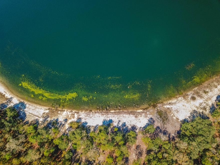 Build your dream home or have a vacation home on this beautiful spring fed lake. Water will always be clear and cool - as it should be in paradise! The lot has been somewhat cleared so you can see the water. MLS 795209 is the adjoining parcel - also for sale for $50,000. Both purchased together get a discount of $5000 for a total price of $80,000. Ask your Realtor for a list of the rules and regulations but there is no HOA. Current zoning allows for a home and outbuilding as long as the outbuilding is not a residence. Please drive by and call if you'd like to make an offer!