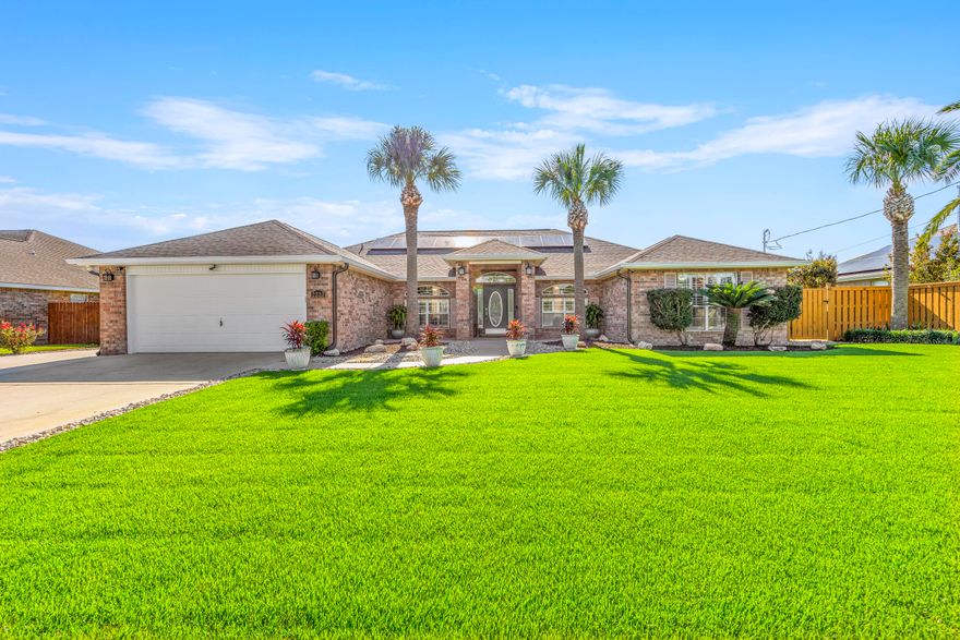 The perfect ''Oasis''on Ortega has hit the market.  This 4 bed/2 bath, all brick home, ''split floor'' plan is a must see. Your initial glance will have you mesmerized by the stunning landscaping and lawn (no grass angels please).   Entering this home will put you right at ease. This spacious, open home will give you room, whether you are alone or people are visiting.  Don't sit down though.  Look at the back yard where you're true oasis awaits. What do you want? The covered patio? The pool? The hot tub, or the fire pit? You decide.  Now remember, you're only a few miles from the sandy beaches, the Navarre pier and shopping.  So, head out, grab food, catch a fresh fish, hit up Aldi's for marshmallows, come home and cook it outside while you relax in the pool.  It's your future ''oasis''