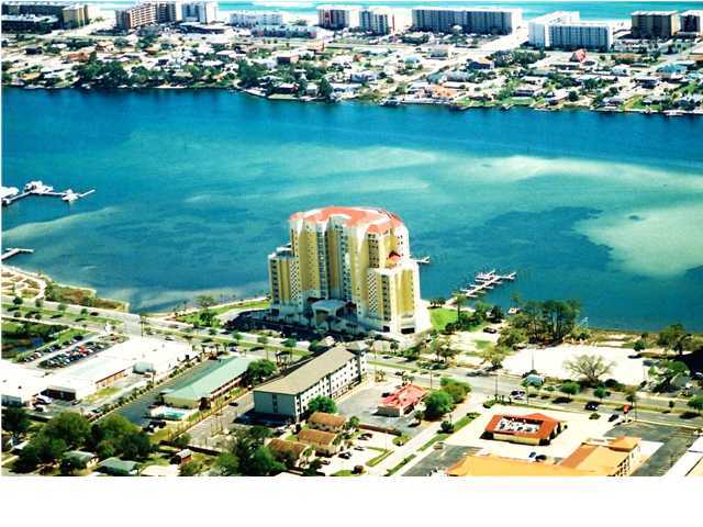 GORGEOUS VIEWS OF GULF AND SOUND. penthouse C- a luxurious condominium located on the sound with the most awesome SUNSET views while enjoying a wrap around balcony that covers north, west and south views....This unit has many upgrades such as TRAVERTINE flooring, Viking Appliances, prewired HAI smart home designs and is technology driven such as energy saving thermo, drapery control, 9 zones of distributed audio, 5.1 surround sound, wi-fi ready wireless internet, and wired for security cameras. The Gourmet Kitchen will have high-end appliances, and has Island with S.S. Sink. The ceilings are about 12' and have crown molding throughout. WATER,SEWAGE, TRASH,GAS, INTERNET INCLUDED!